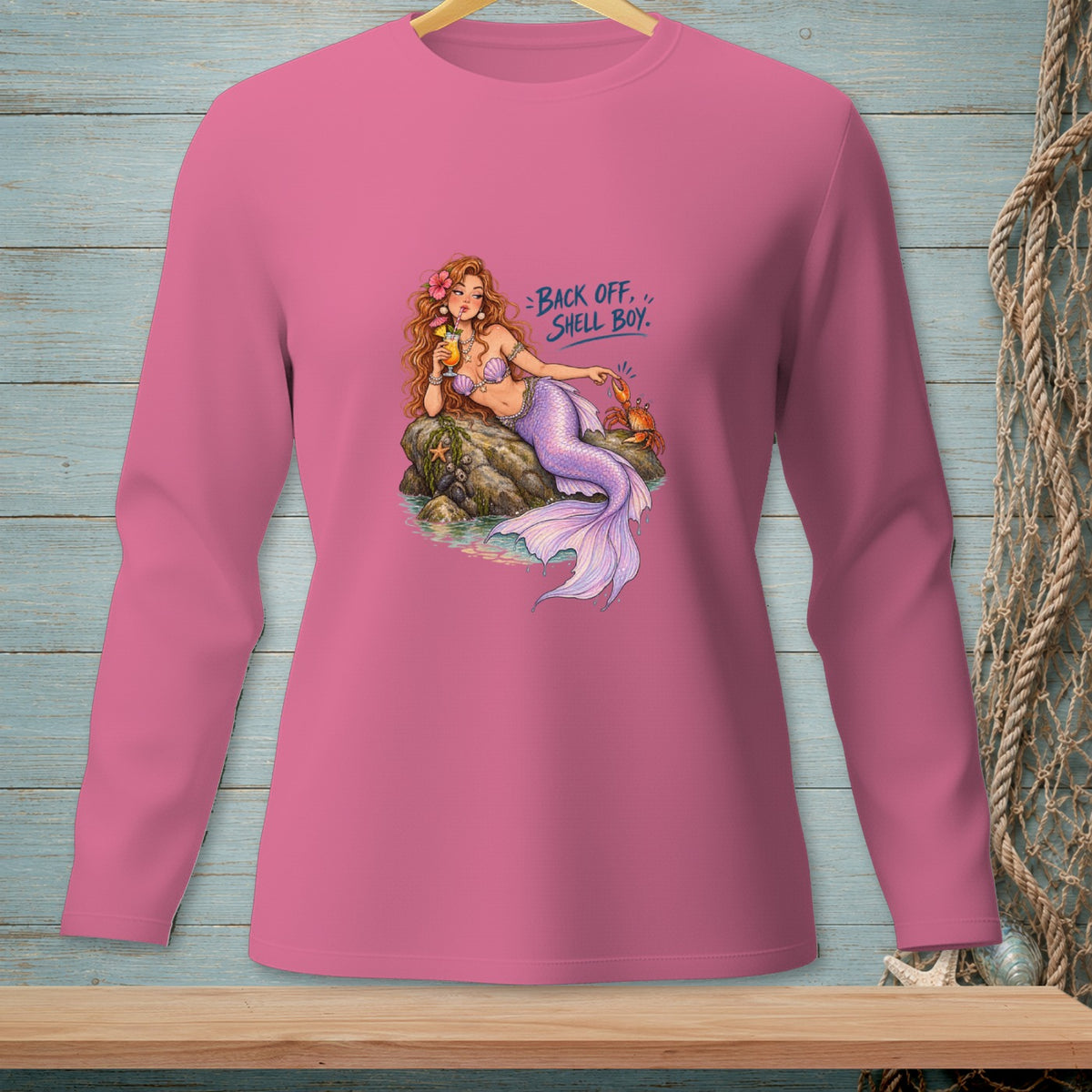 Pink long-sleeve shirt with a mermaid graphic that reads "Back Off, Shell Boy."