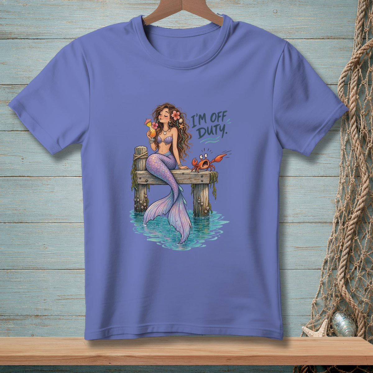 Mermaid with drink and crab on a pier, text reads "I'M OFF DUTY."
