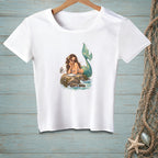 White t-shirt featuring a mermaid with a seagull on a rock.