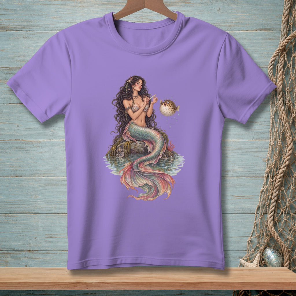 Purple t-shirt with a mermaid sitting on a rock, interacting with a pufferfish.