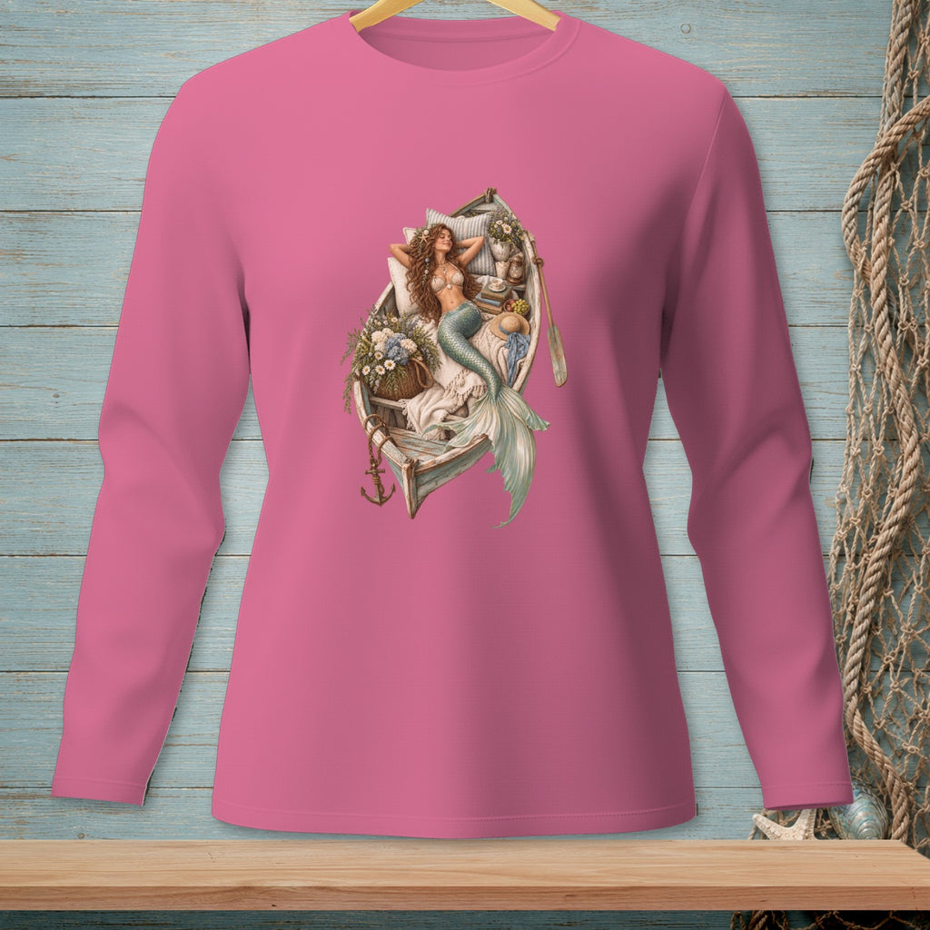 Pink long-sleeve shirt with a graphic of a mermaid relaxing in a boat.