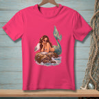 Mermaid with sunglasses eating cake on a rock with a seagull.
