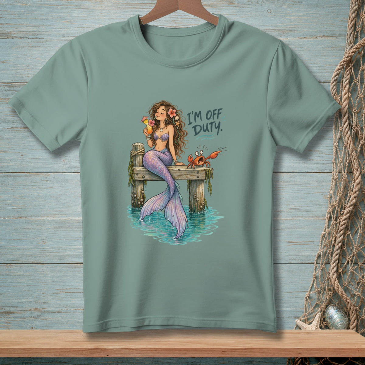 Illustration of mermaid with drink and crab on dock with text "I'M OFF DUTY".