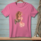 Pink t-shirt with illustration of a mermaid sitting on a wooden post.