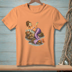 Mermaid relaxing on rocks with a drink, wearing cucumber eye patches and a seashell bikini.