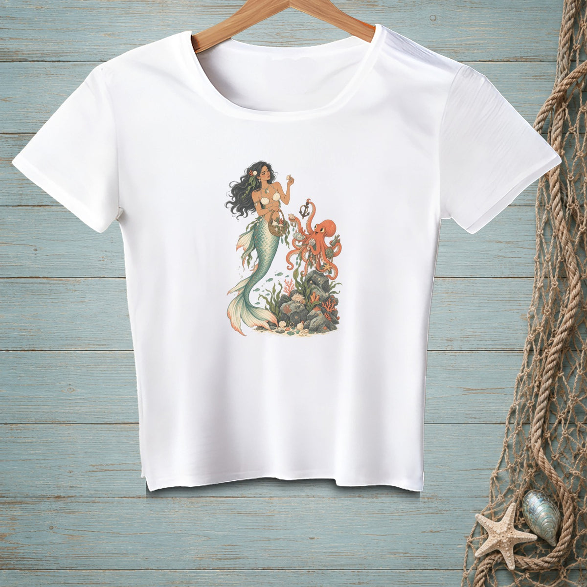 White t-shirt featuring a mermaid interacting with an octopus and coral reef illustration.
