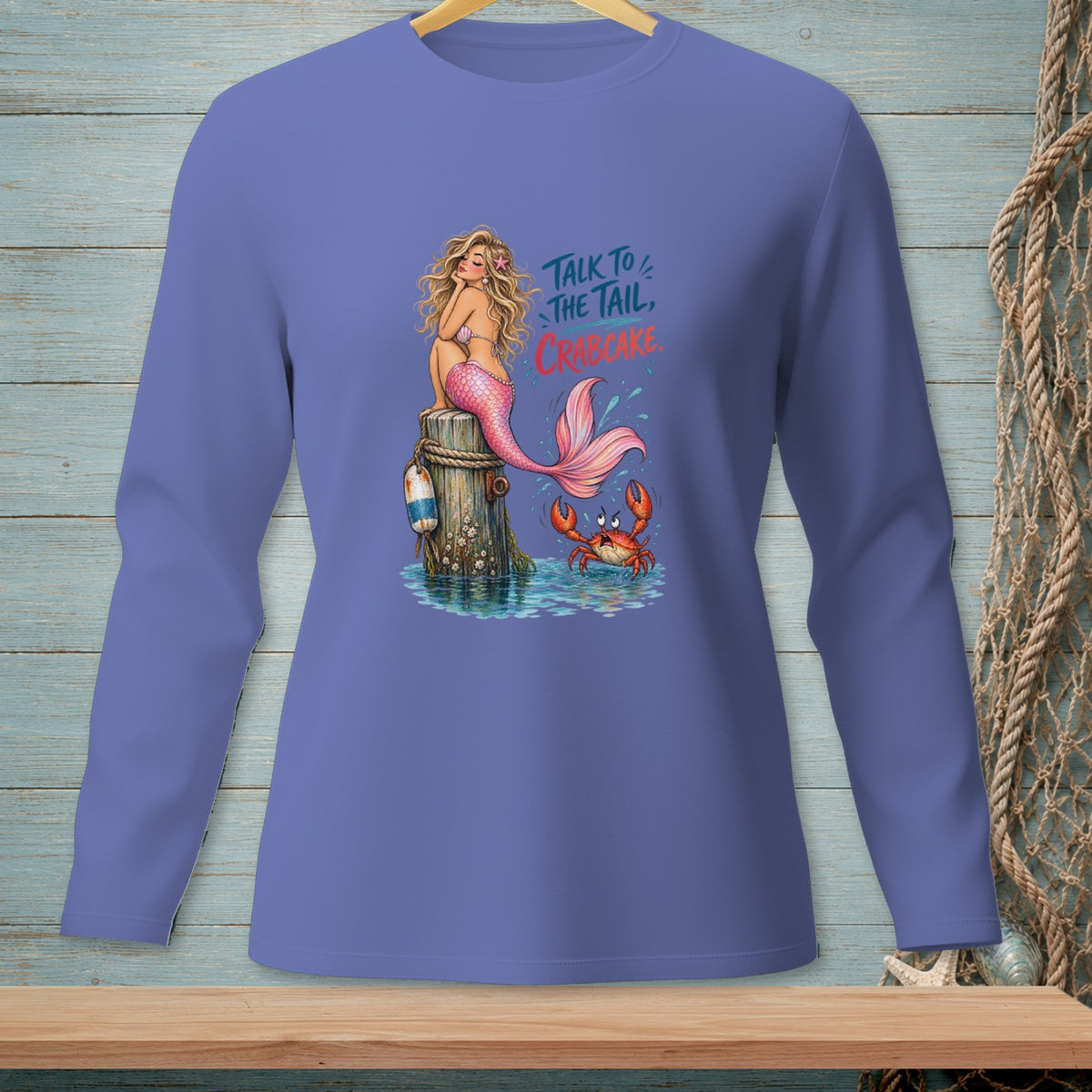 Mermaid on wooden post with crab, text says "Talk to the Tail, Crabcake."