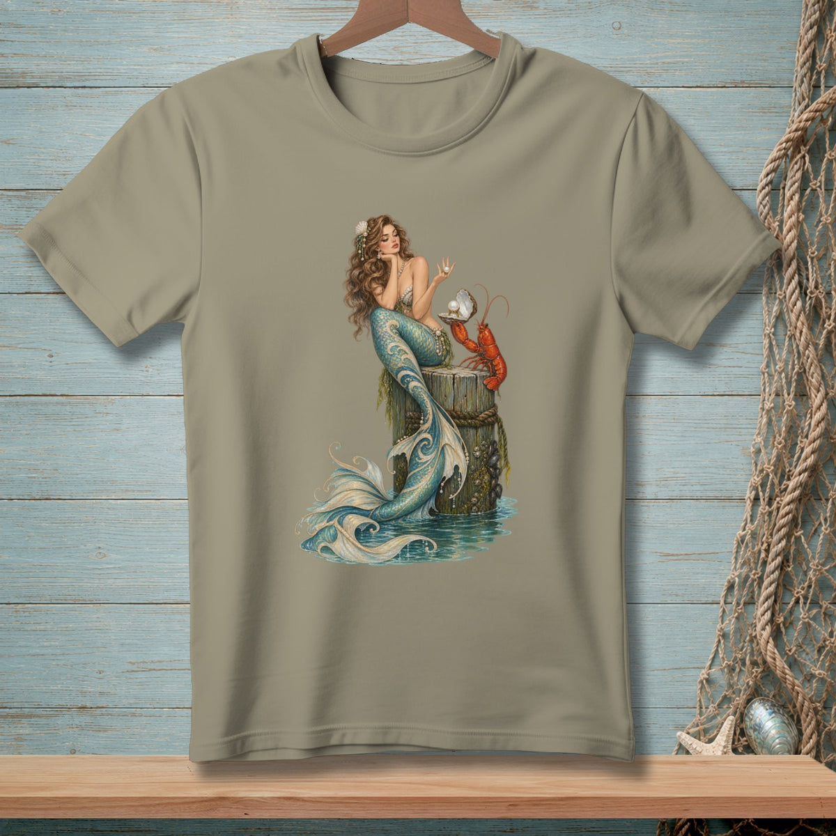 Mermaid with lobster and pearl on weathered wood post on tan t-shirt.