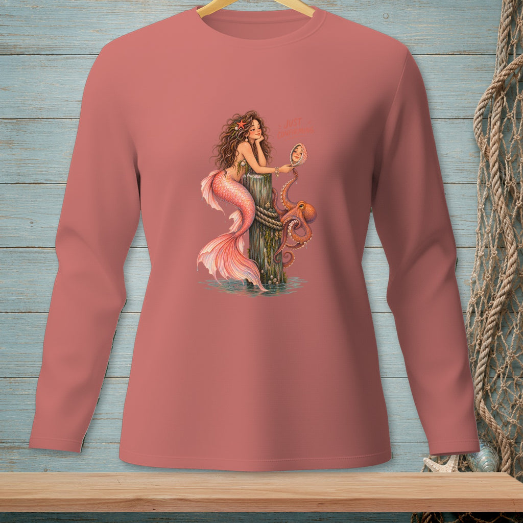 Mermaid with pink tail and octopus on pier, holding mirror, text "JUST CONFIRMING".