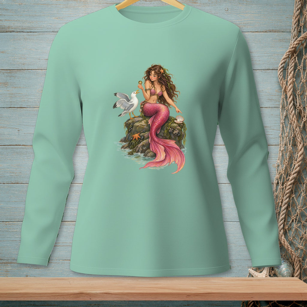 Mint green long-sleeve shirt with a graphic of a mermaid and seagull on a rock.