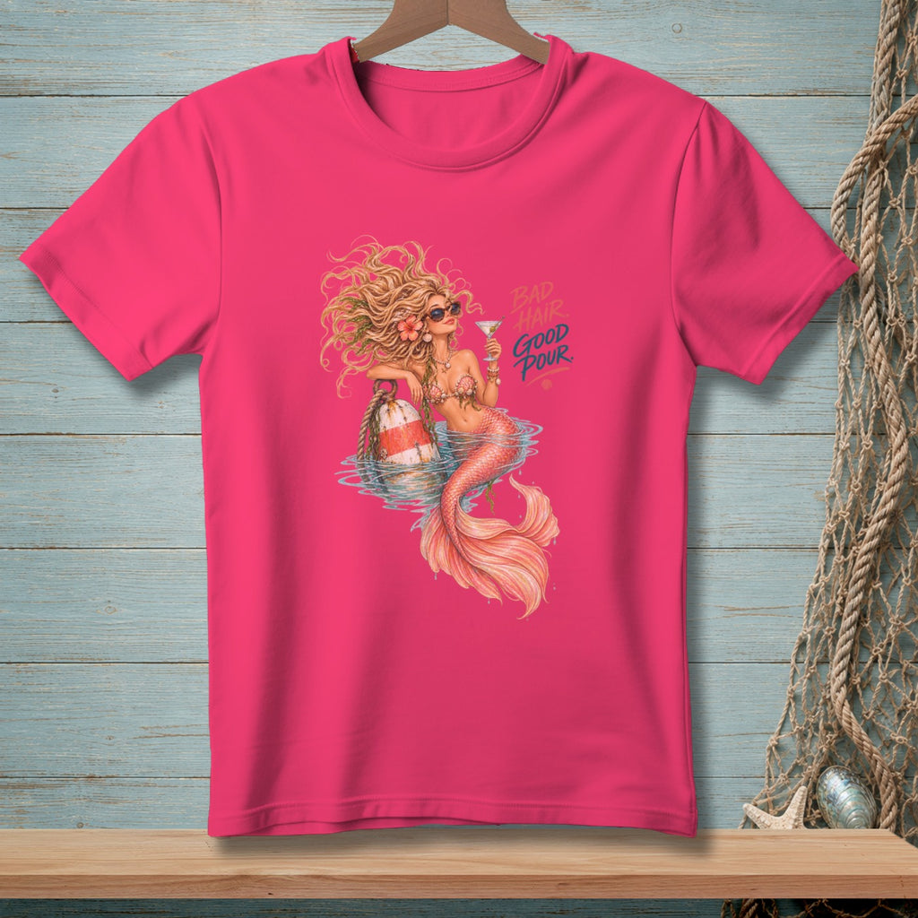 Mermaid with cocktail and text "Bad Hair Good Pour" on pink t-shirt.