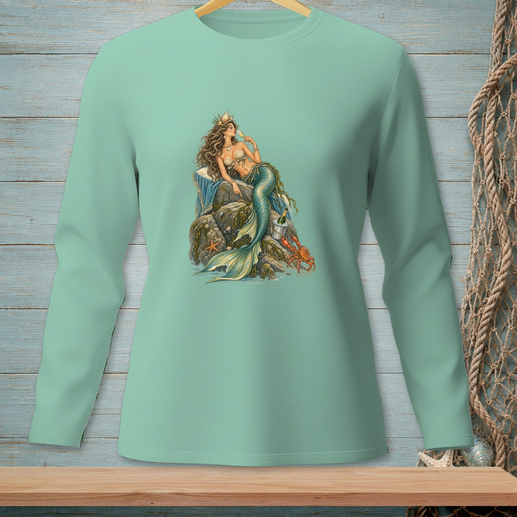 Mint green long-sleeve shirt with a mermaid graphic holding champagne.