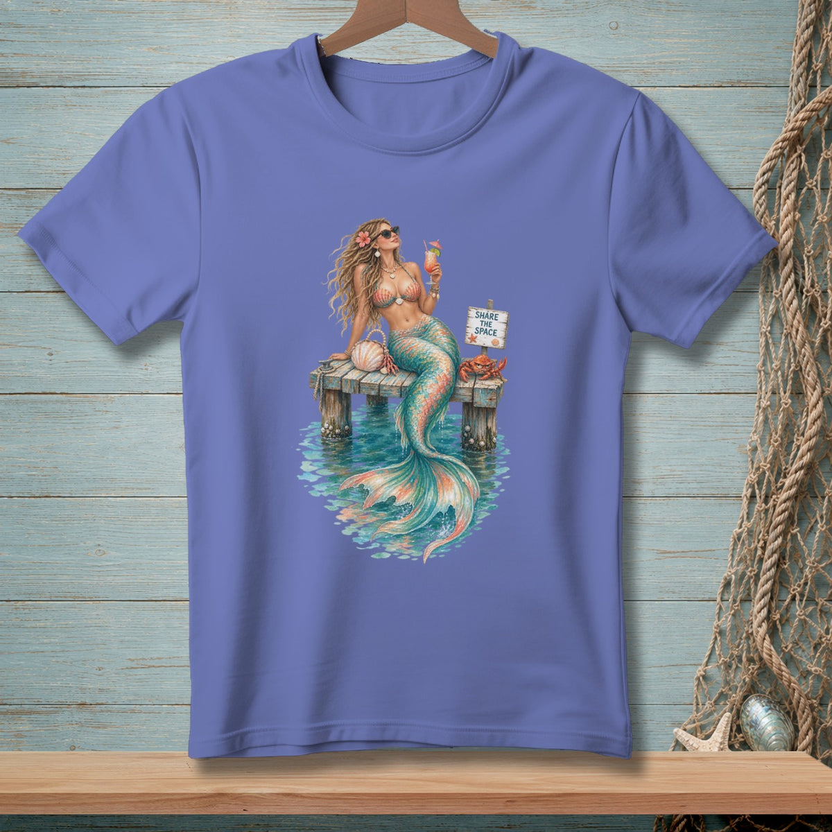 Mermaid on pier with cocktail and sign saying "Share the Space."