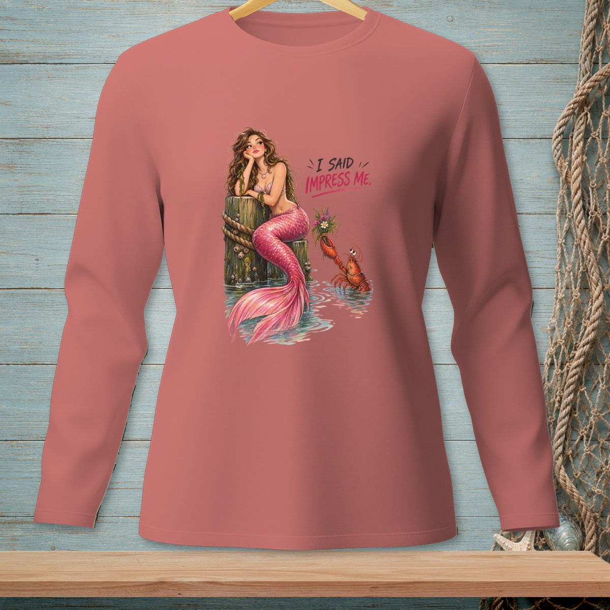 Mermaid with pink tail and a lobster, text "I SAID IMPRESS ME."