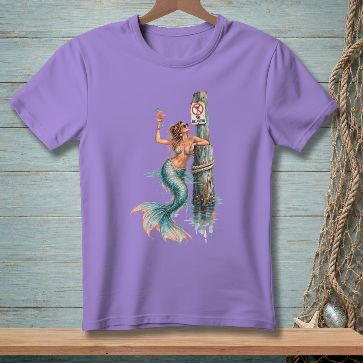Purple t-shirt with mermaid holding a drink next to a "No Drinking" sign.