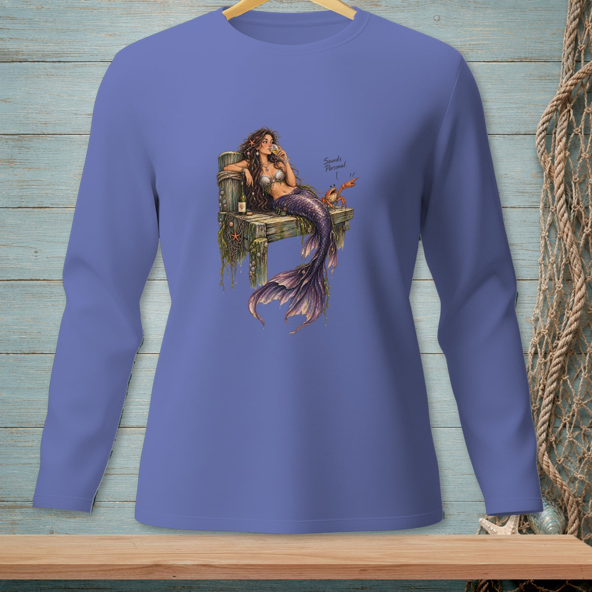 Mermaid on wooden dock drinking wine with crab and text "Sounds Personal".