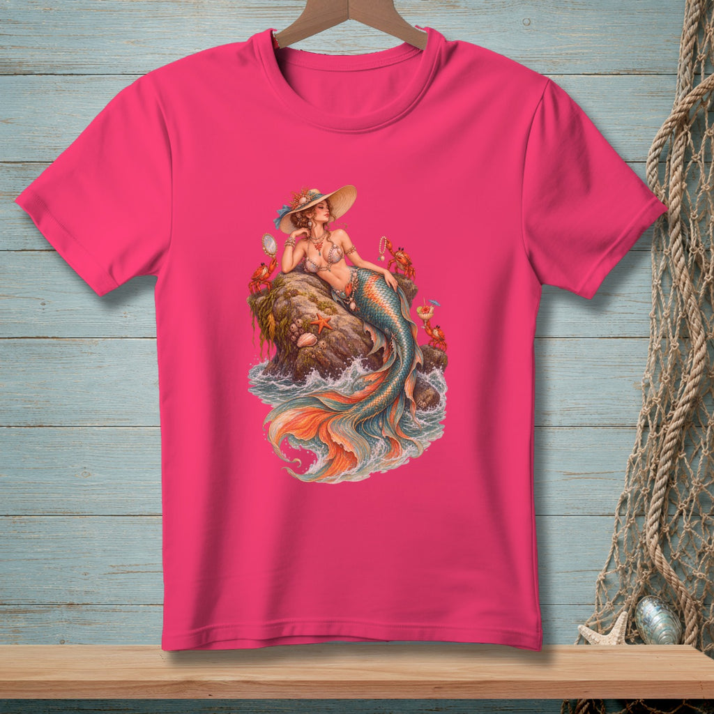 Pink t-shirt with a mermaid sitting on a rock with crabs and starfish.