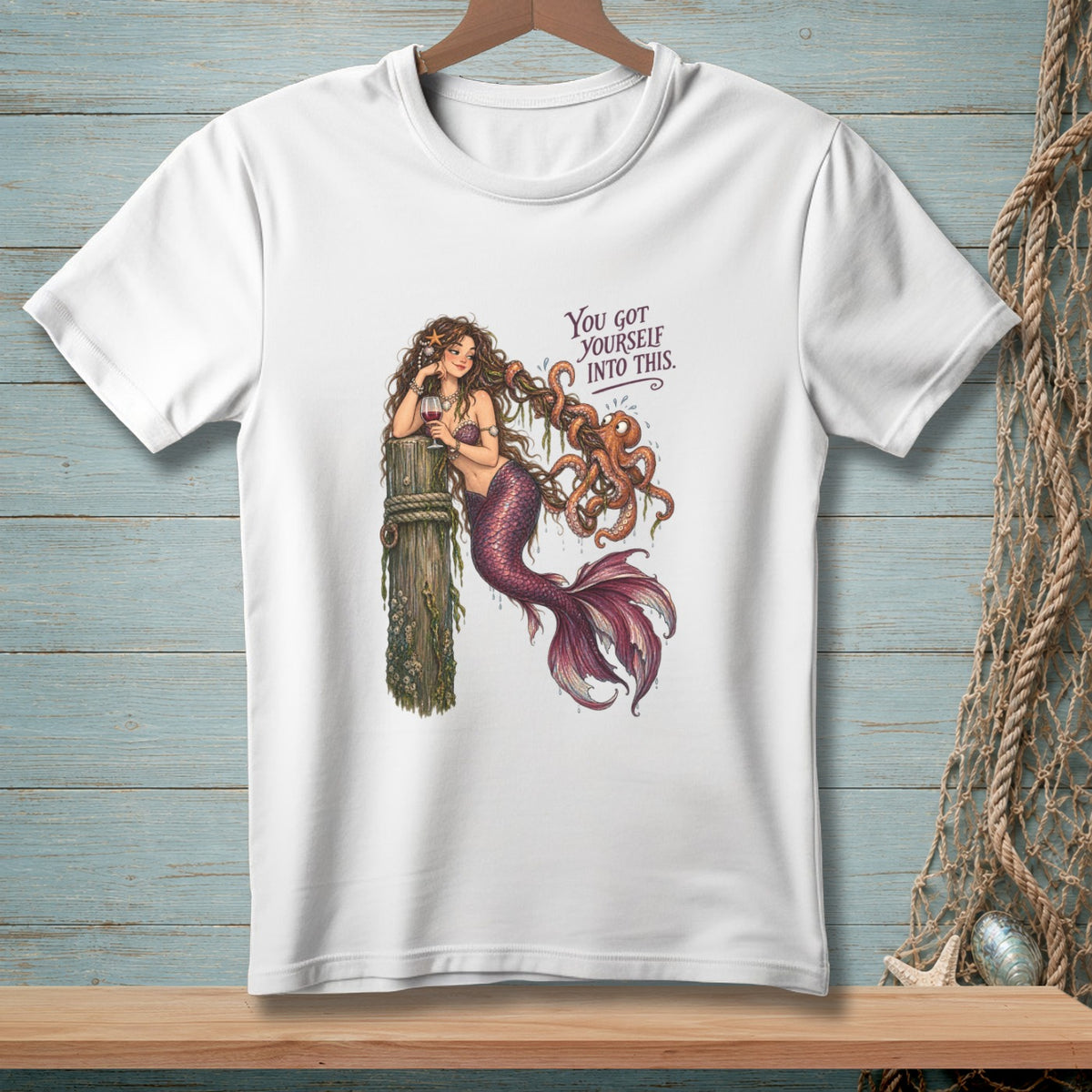 White t-shirt with a mermaid tangled with an octopus and the text "You got yourself into this."