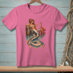 Pink t-shirt featuring a mermaid with an octopus and a shell.