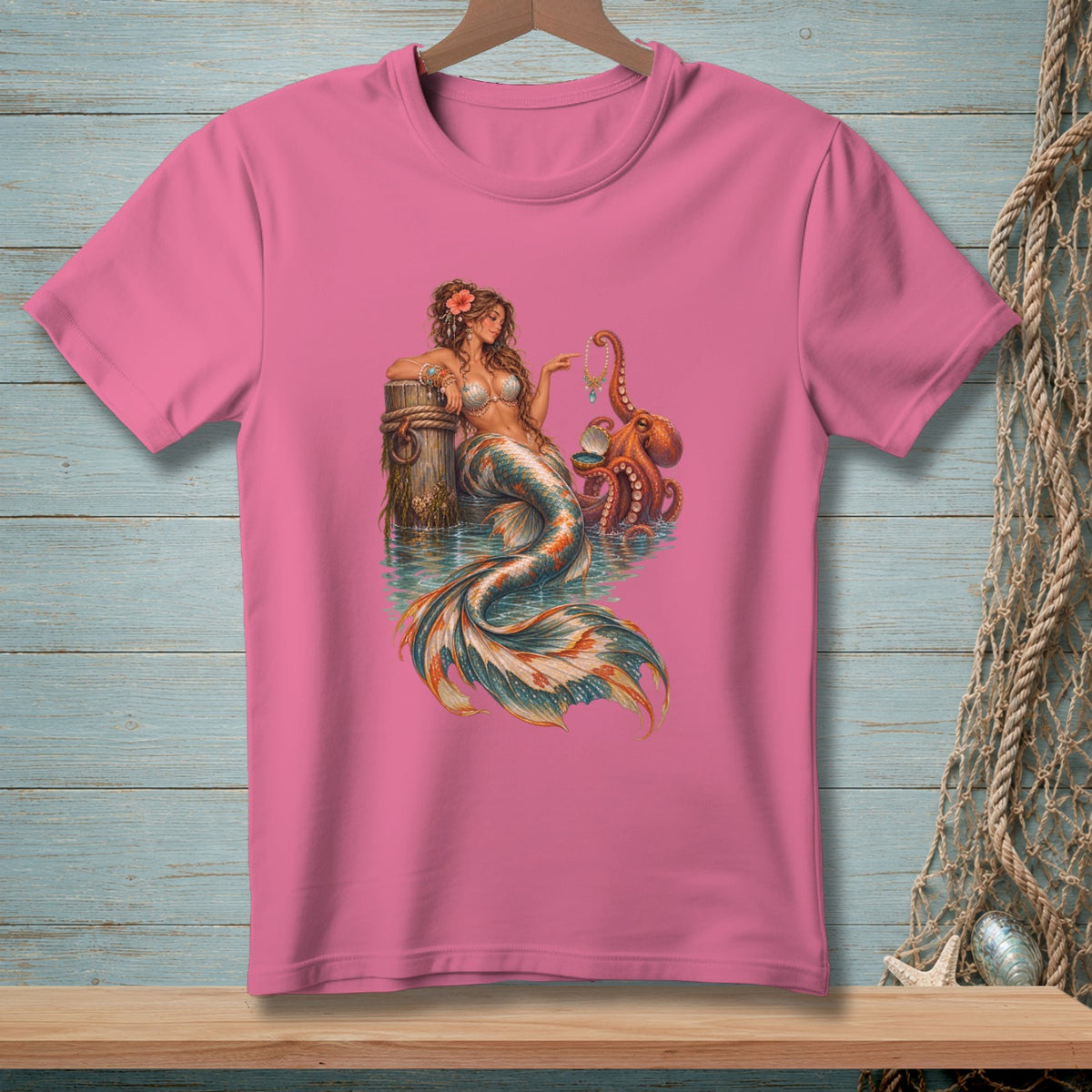 Pink t-shirt featuring a mermaid with an octopus and a shell.