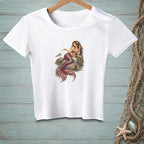 White t-shirt with a detailed illustration of a mermaid sitting on rocks with a seagull.