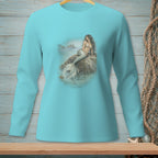 Mermaid sitting on a rock by the ocean with a crab nearby, printed on a teal long-sleeve shirt.