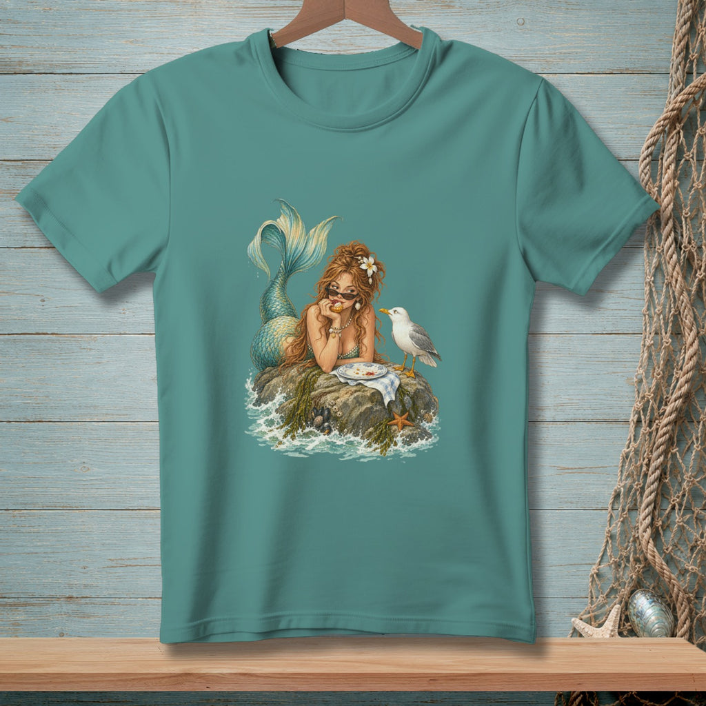Illustration of a mermaid eating with a seagull on a rock.