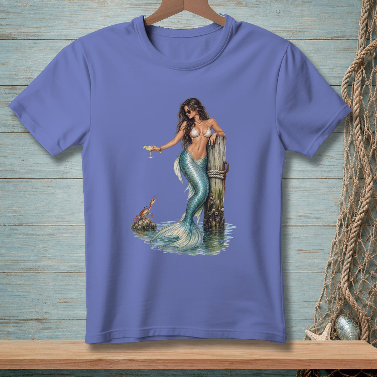 Mermaid in bikini and sunglasses holding a drink, leaning on a dock post with a crab.