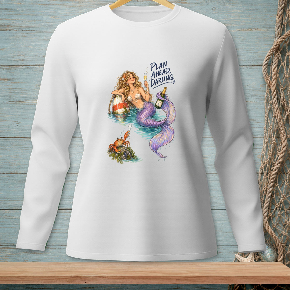 Mermaid and crab with champagne, text reads "Plan Ahead, Darling".
