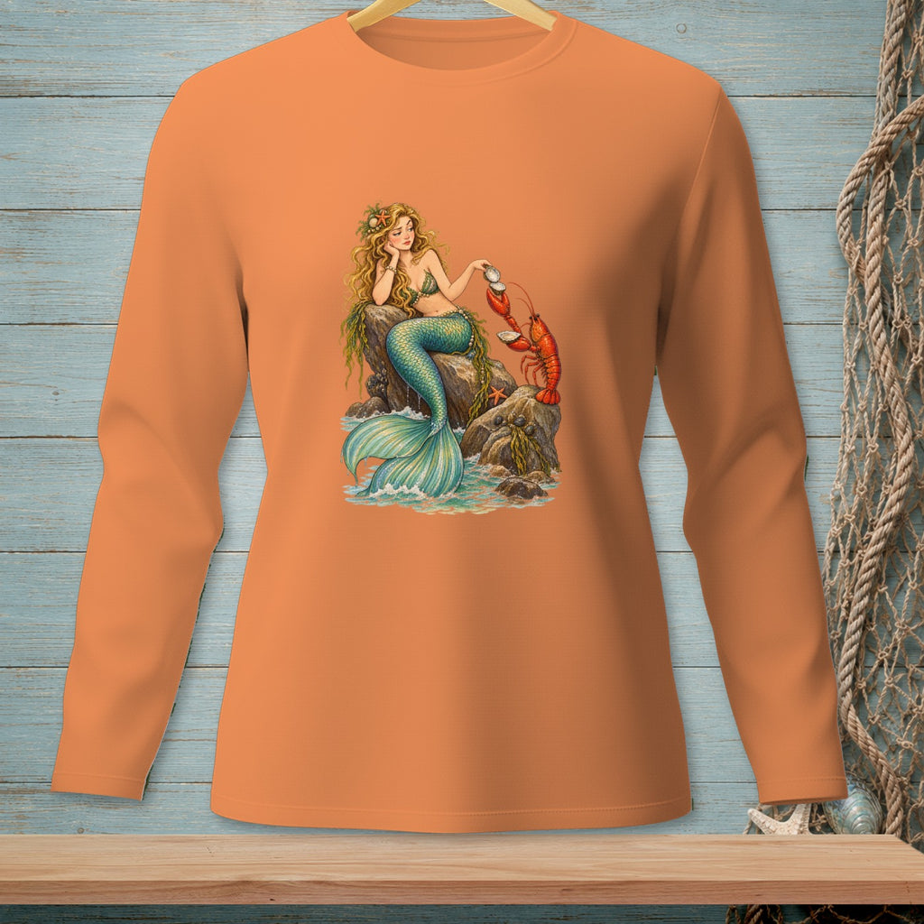 Mermaid sitting on rocks with a lobster, displayed on an orange long-sleeved shirt.