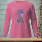 Pink long-sleeve shirt with "Good Vibes & High Tides" text and mermaid tail graphic.