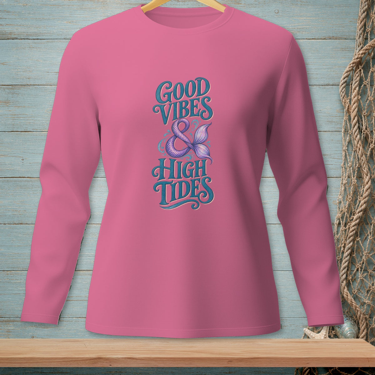 Pink long-sleeve shirt with "Good Vibes & High Tides" text and mermaid tail graphic.