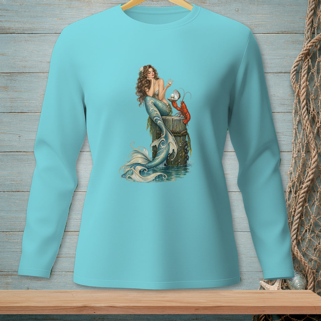 Mermaid with lobster and pearl on a wooden post, printed on a teal long-sleeve shirt.