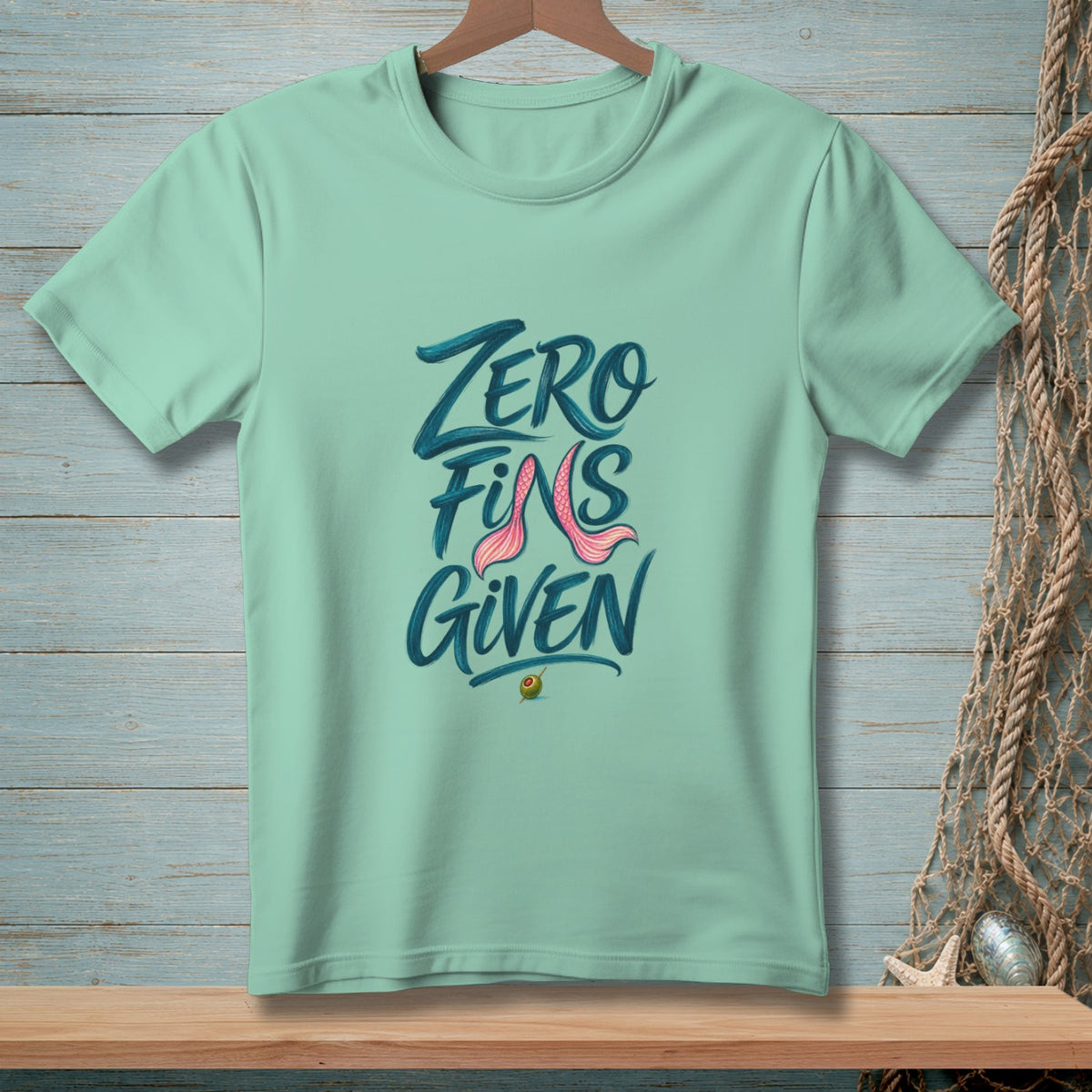 Mint green t-shirt with "ZERO FINS GIVEN" text and avocado graphic.