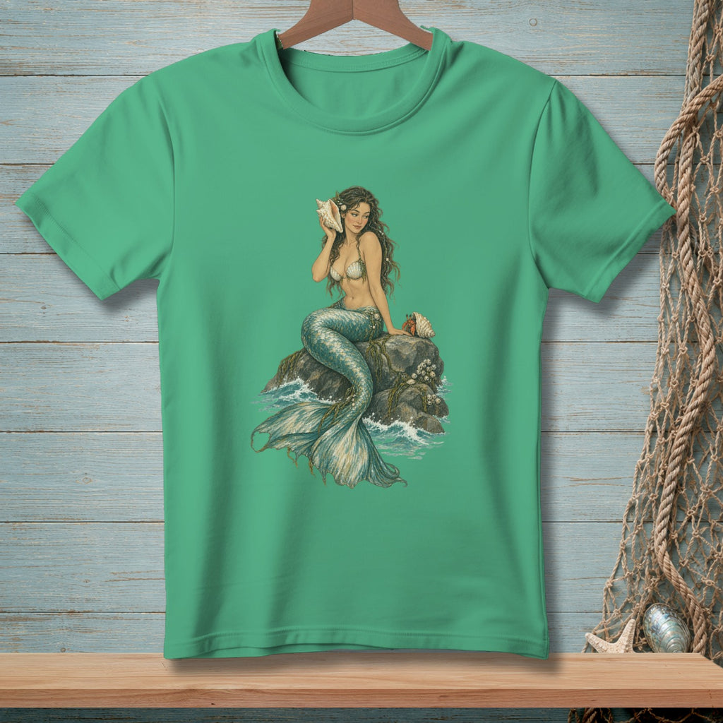 Green t-shirt featuring a mermaid holding a seashell, seated on a rock.