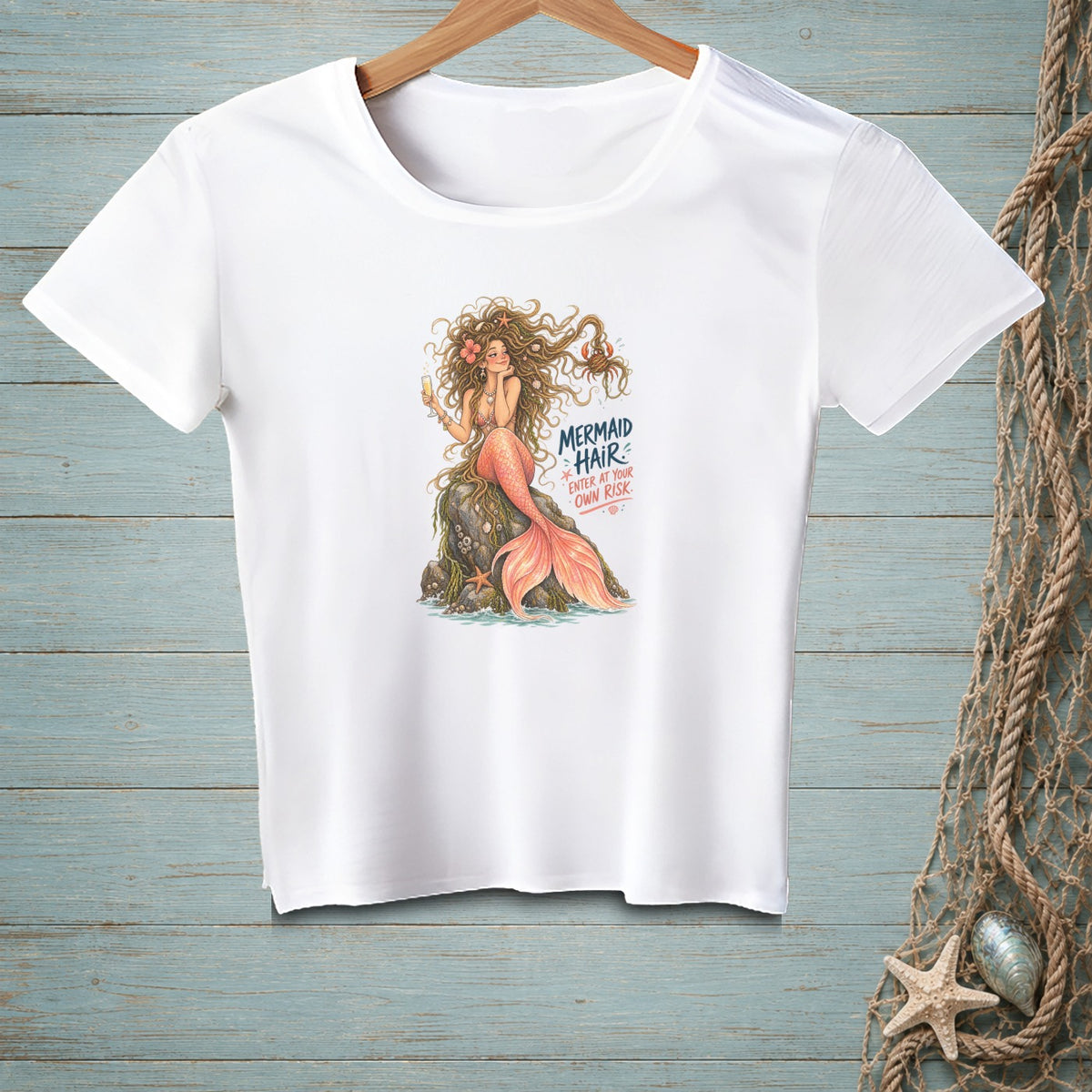 White t-shirt with illustration of mermaid and text "Mermaid Hair Enter at Your Own Risk".