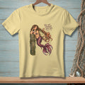 Light yellow t-shirt with a mermaid and octopus graphic and the text "You got yourself into this."