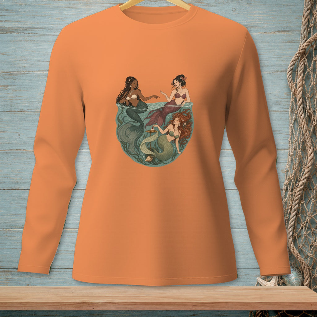 Three mermaids in a circular underwater scene, one holding a teacup.