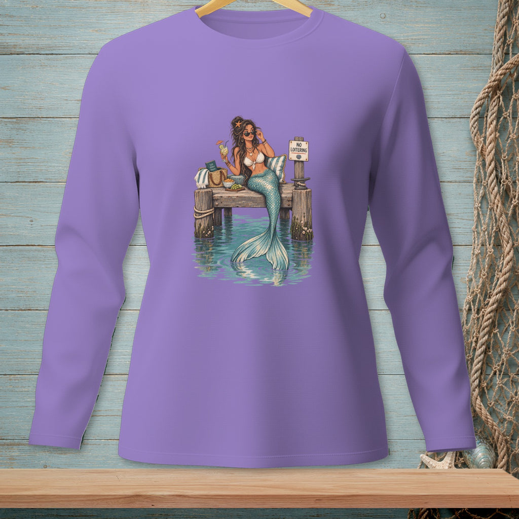 Mermaid with cocktail and "No Loitering" sign on a dock over water.