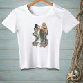 White t-shirt with graphic of two mermaids sitting on a pier post.