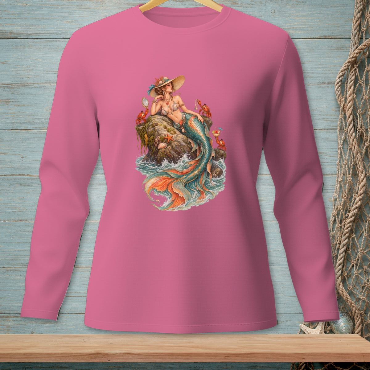 Mermaid with hat sitting on rocks with crabs and starfish.