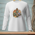 Three mermaids sit on rocks sharing a cake.