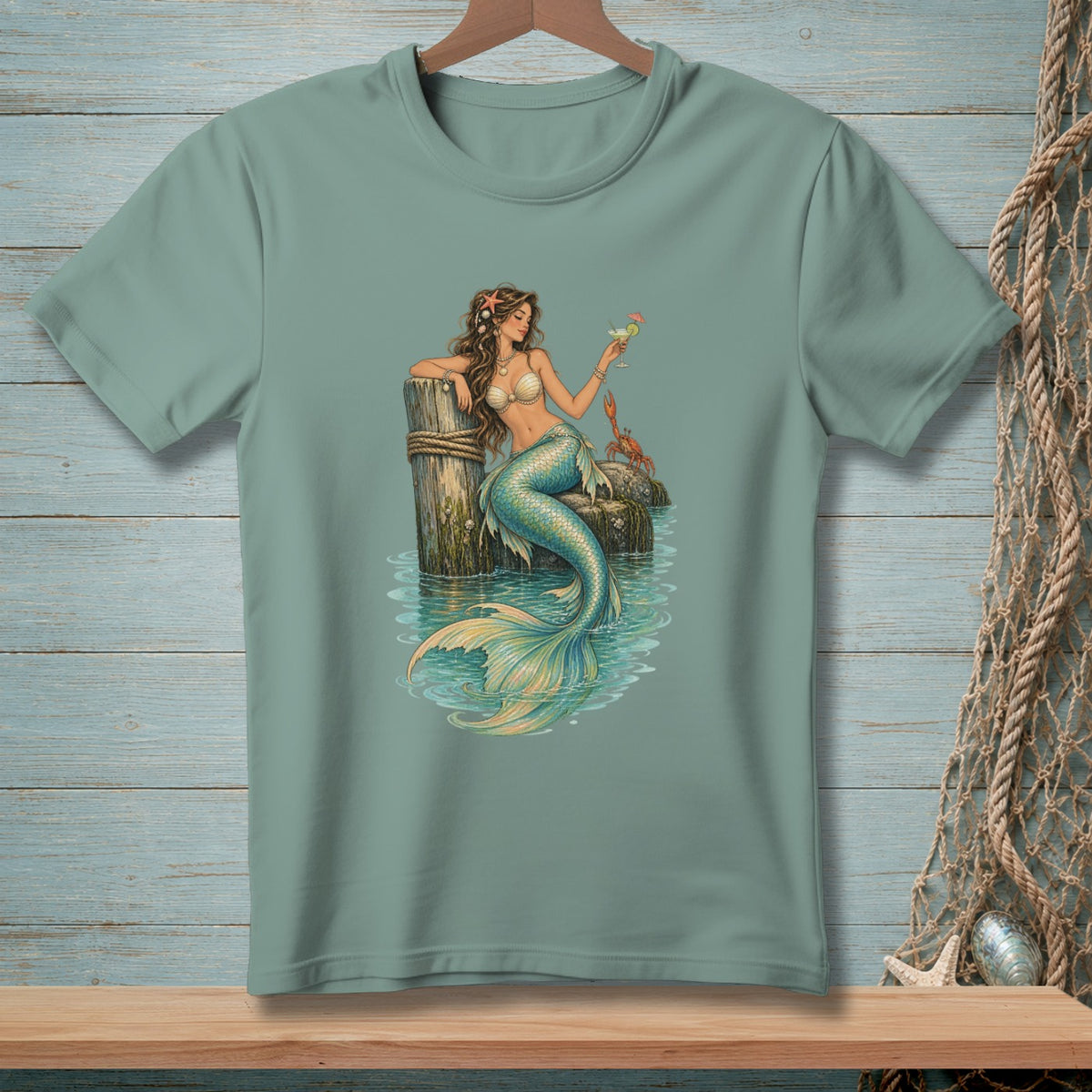 Mermaid on a dock with a cocktail and a crab.
