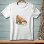 White t-shirt with a mermaid on a rock, holding a drink, with text "Plans Changed."