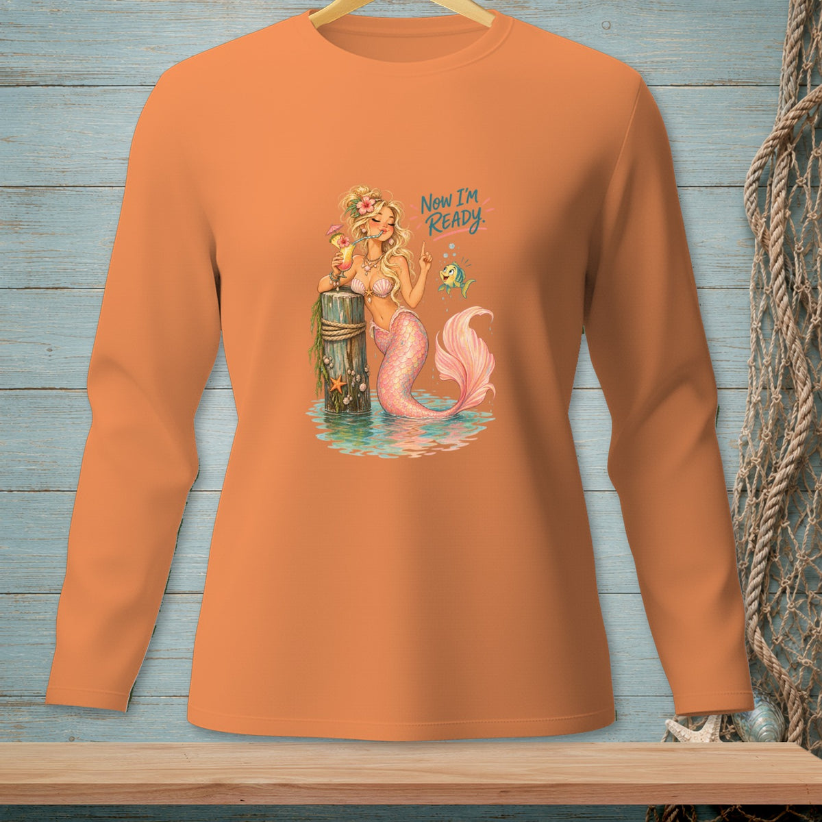 Orange long-sleeve shirt with a mermaid graphic that reads "Now I'm Ready."