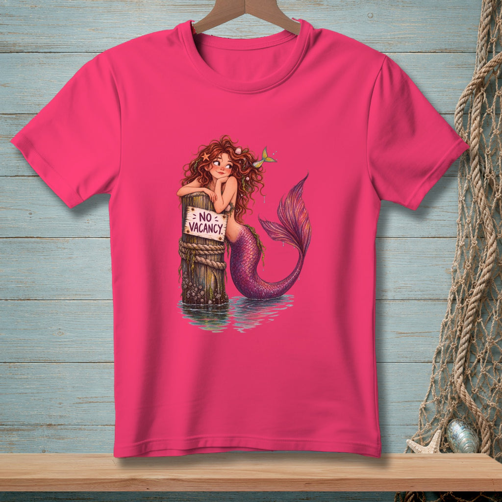 Pink t-shirt with mermaid leaning on post with "NO VACANCY" sign.