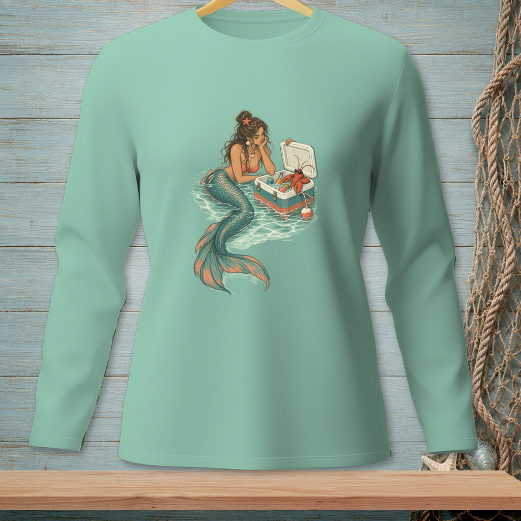 Mermaid with lobster and cooler in ocean waves graphic on a mint long-sleeve shirt.