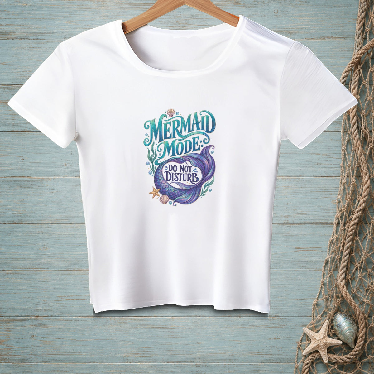 White t-shirt with "Mermaid Mode" and "Do Not Disturb" text, featuring a mermaid tail.