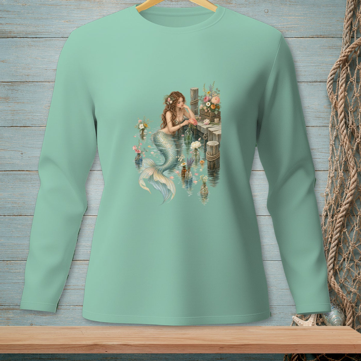 Mermaid sitting by a wooden dock surrounded by flowers in bottles.