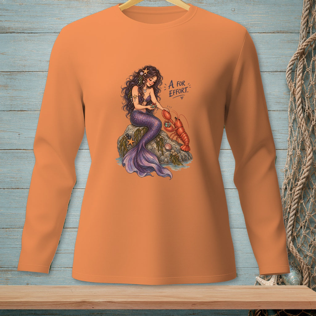 Orange long-sleeve shirt with mermaid and lobster graphic saying "A for Effort".